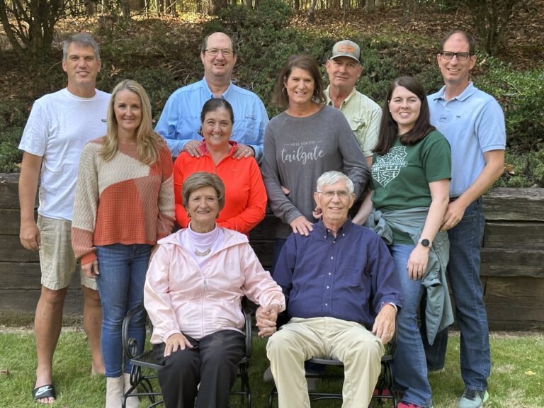Large multi-generational family group outdoors