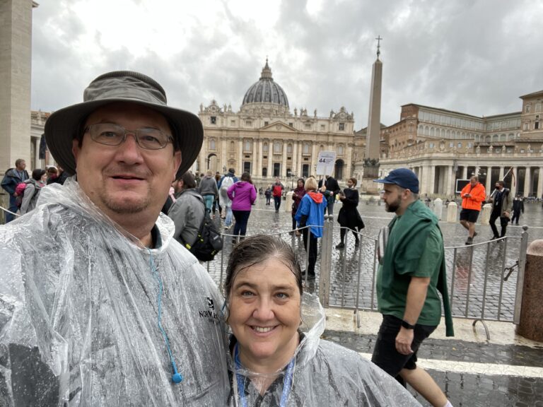 Couple in rain ponchos in St. Peters Square