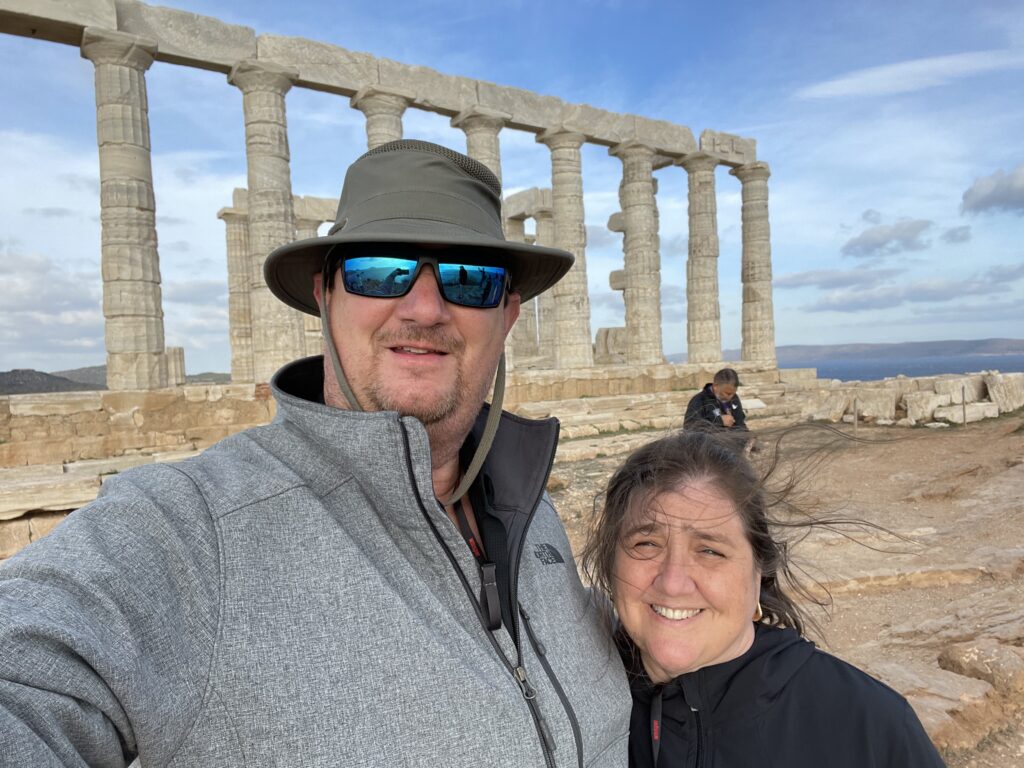 Couple at ancient temple columns on the Acropolis